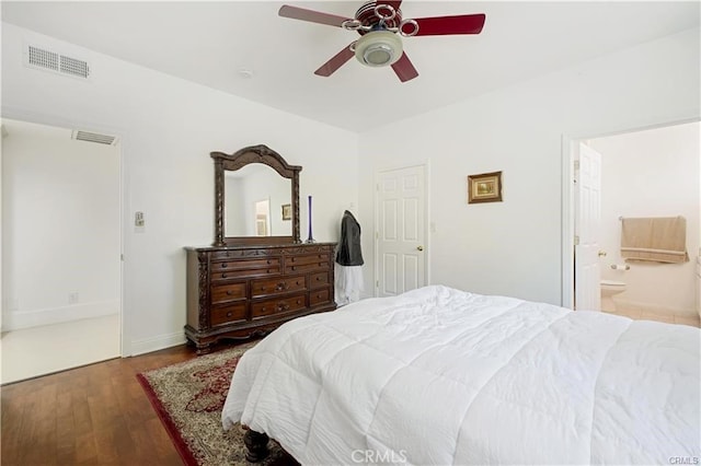 bedroom featuring ceiling fan, ensuite bathroom, and hardwood / wood-style floors