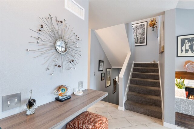 entryway featuring light tile patterned floors