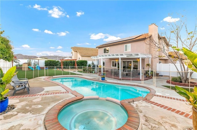 view of pool featuring a mountain view, a pergola, a patio, and an in ground hot tub