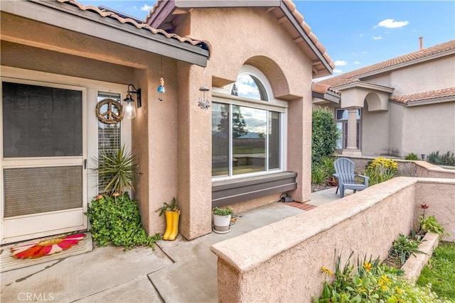 property entrance with a patio