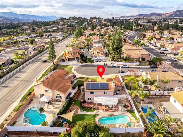 birds eye view of property with a mountain view