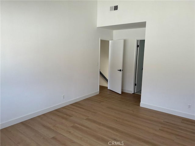 spare room featuring hardwood / wood-style floors