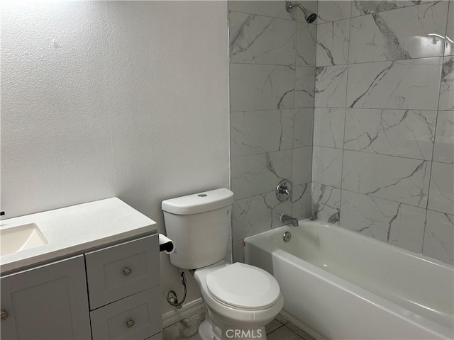 full bathroom with vanity, tiled shower / bath, and toilet