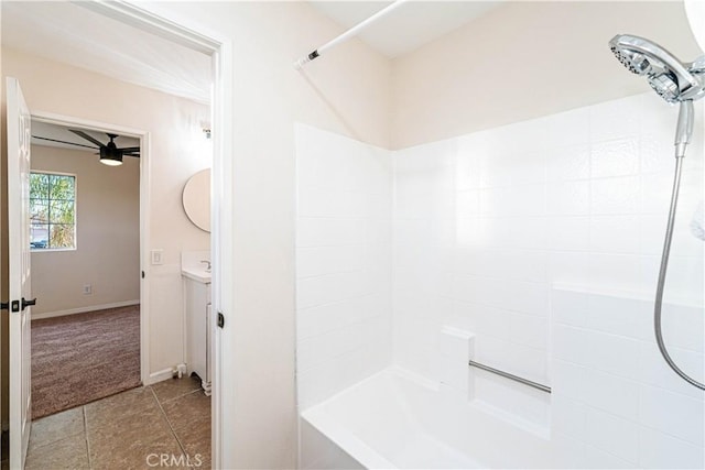 bathroom featuring tile patterned floors, vanity, and  shower combination