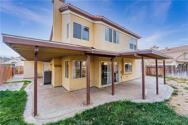 back of property featuring a patio