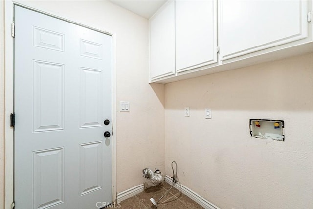 laundry room featuring washer hookup and cabinets