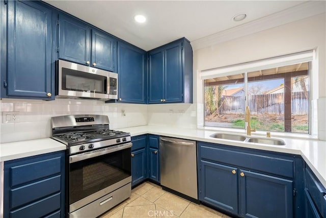 kitchen featuring blue cabinetry and appliances with stainless steel finishes