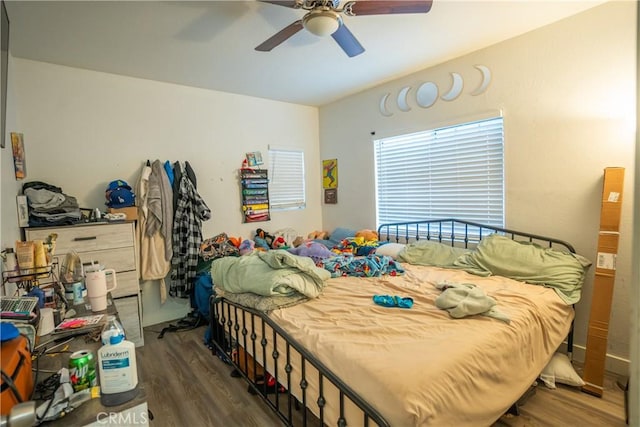 bedroom featuring dark wood-type flooring and ceiling fan