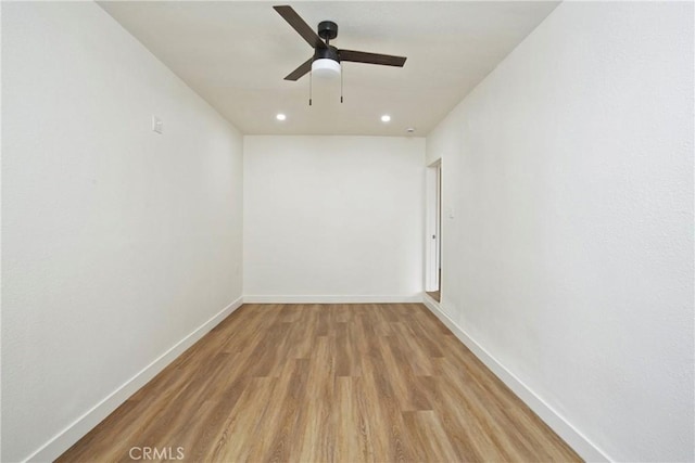 empty room featuring light hardwood / wood-style flooring and ceiling fan