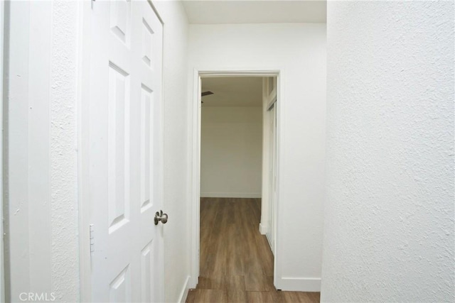 hallway featuring wood-type flooring