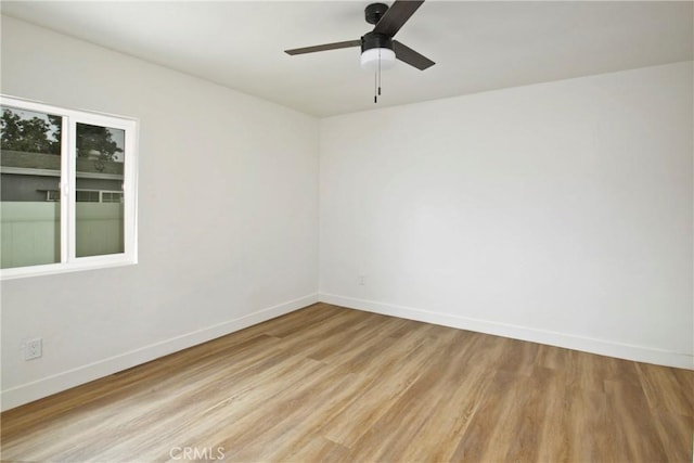 unfurnished room featuring ceiling fan and light hardwood / wood-style flooring