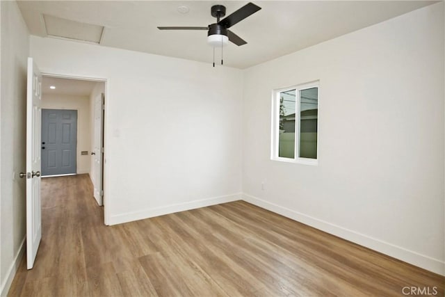 spare room featuring wood-type flooring