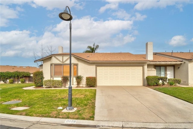 view of front of home featuring a garage and a front yard