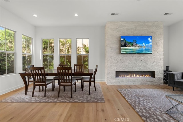 interior space featuring visible vents and a stone fireplace