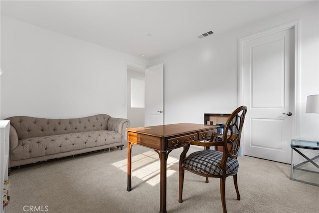 home office featuring visible vents and light colored carpet