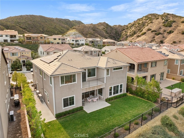 drone / aerial view with a residential view and a mountain view