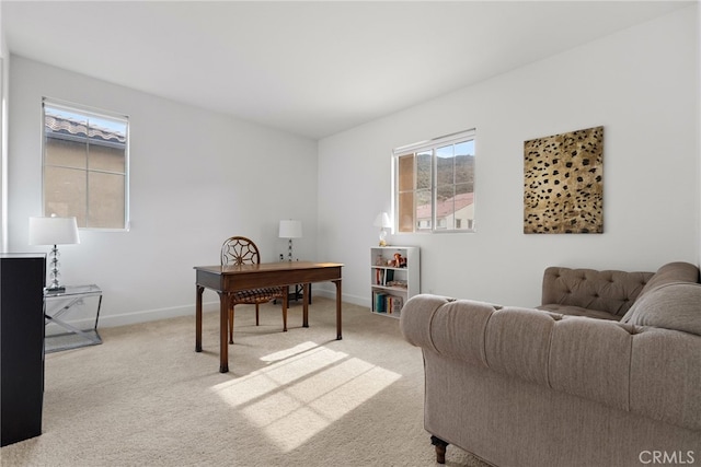 office area with baseboards and light colored carpet