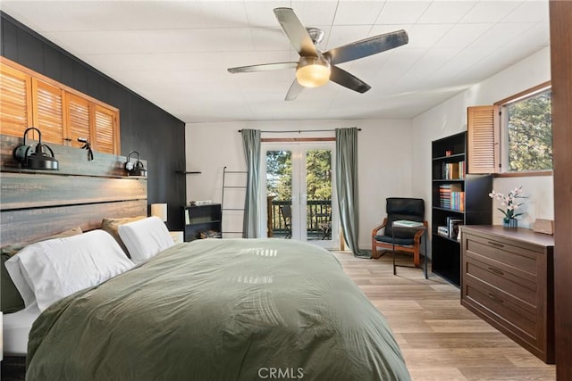 bedroom with access to exterior, ceiling fan, and light hardwood / wood-style floors