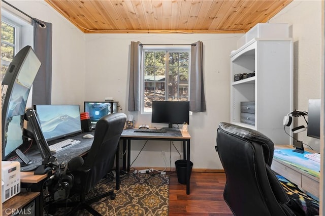 office space with ornamental molding, dark wood-type flooring, and wooden ceiling