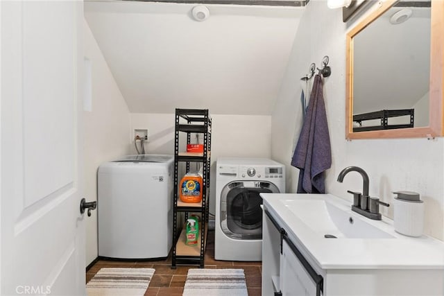 washroom featuring sink and independent washer and dryer