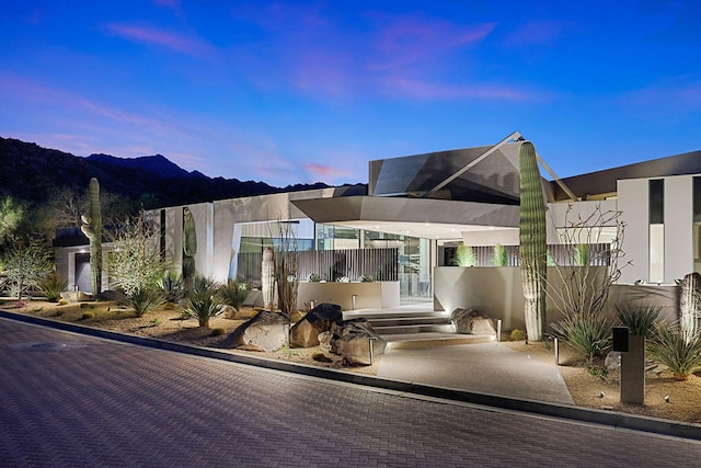 view of front of property with a mountain view