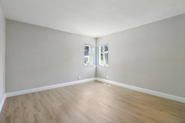 unfurnished room featuring light hardwood / wood-style floors