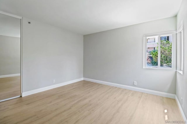 empty room with light wood-type flooring