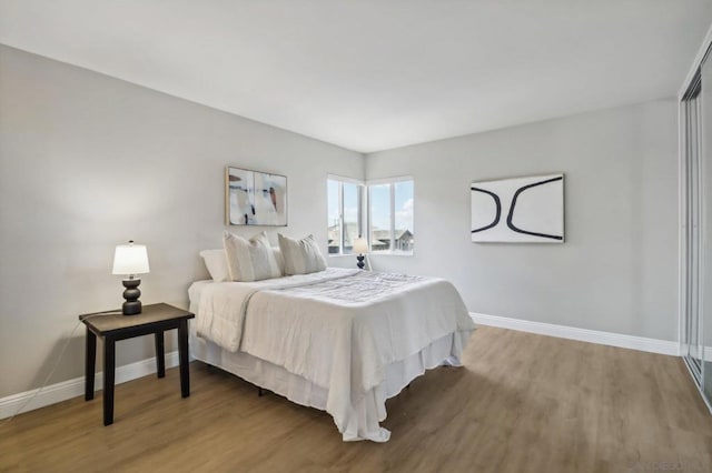 bedroom with wood-type flooring