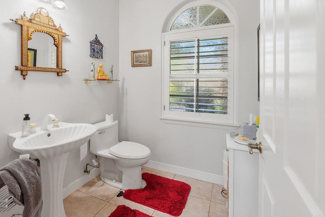 bathroom with tile patterned flooring and toilet