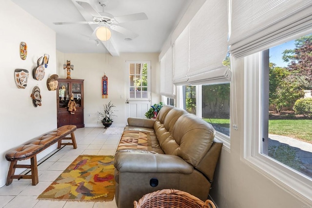 living room featuring light tile patterned floors, plenty of natural light, and ceiling fan