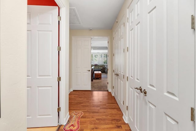 hallway with light wood-type flooring