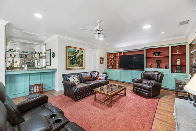 living room featuring crown molding, ceiling fan, and light hardwood / wood-style floors