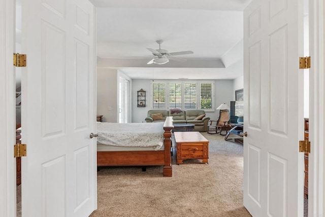 carpeted bedroom featuring ceiling fan