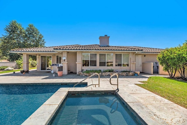 rear view of house with a patio area