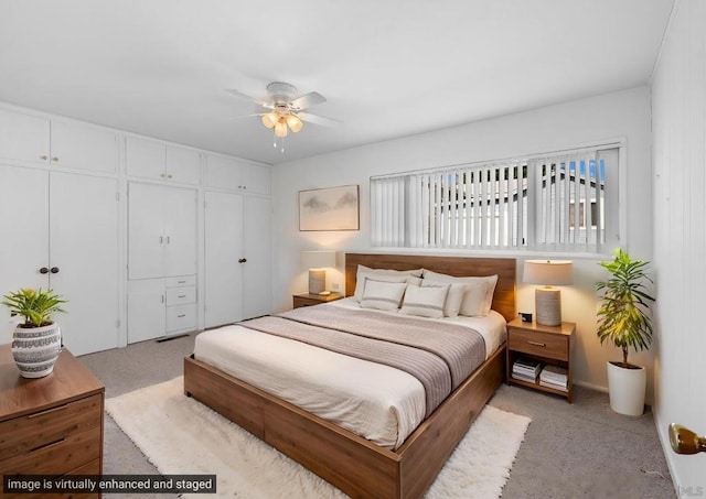 carpeted bedroom with a closet and ceiling fan