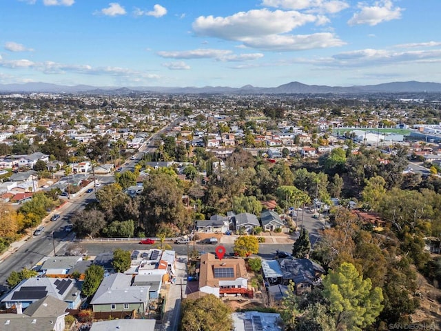 birds eye view of property with a mountain view