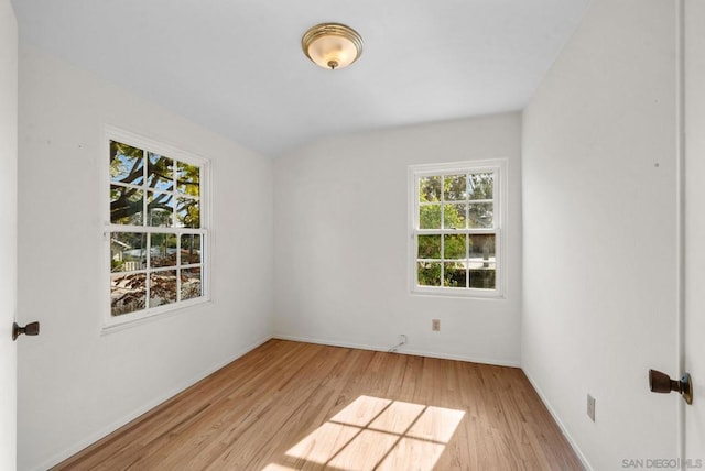 spare room with light wood-type flooring