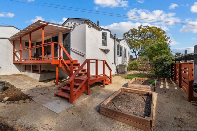 rear view of house featuring a patio area and central air condition unit