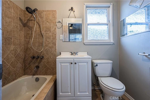 full bathroom with vanity, toilet, and tiled shower / bath