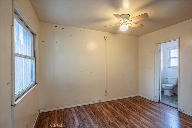 empty room featuring dark hardwood / wood-style floors and ceiling fan