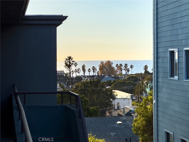 balcony at dusk with a water view