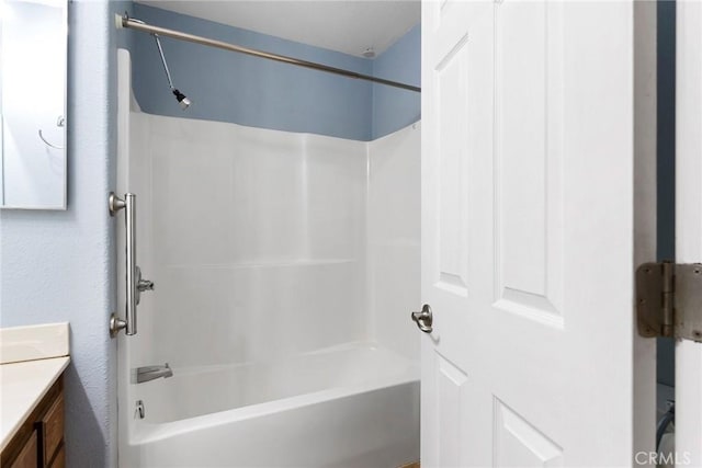 bathroom featuring vanity and washtub / shower combination