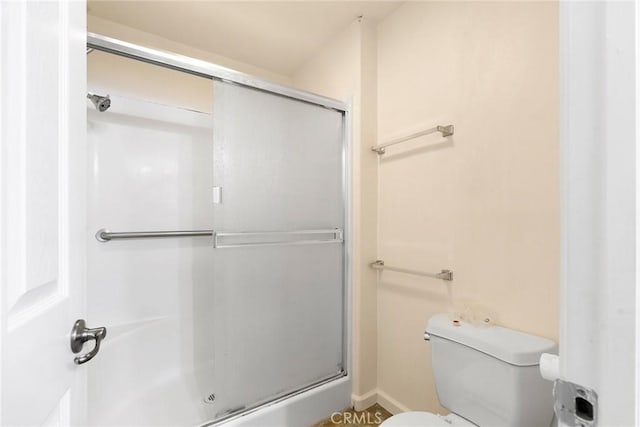 bathroom with walk in shower and toilet