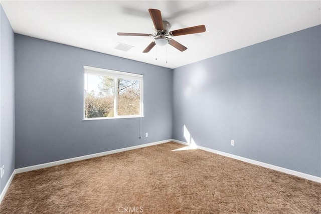 carpeted empty room featuring ceiling fan