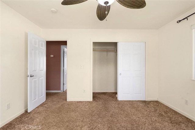 unfurnished bedroom with carpet floors, a closet, and ceiling fan