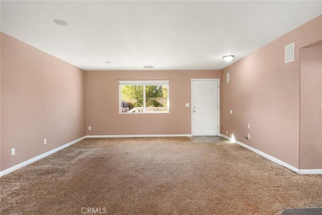 spare room featuring carpet floors