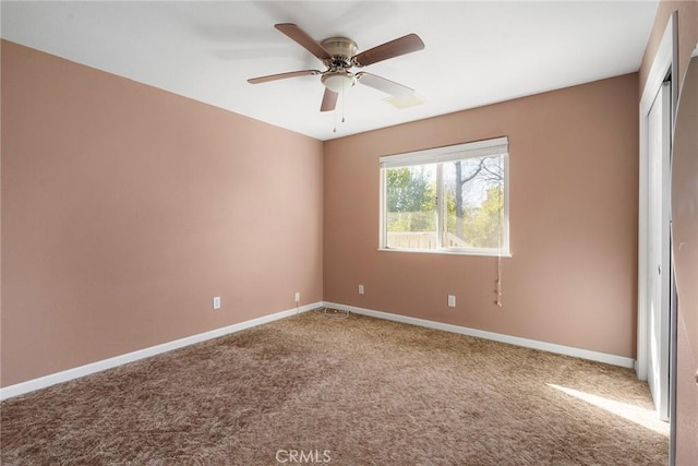 unfurnished room featuring carpet floors and ceiling fan