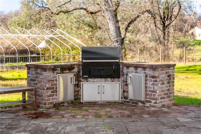 view of patio featuring a grill and exterior kitchen