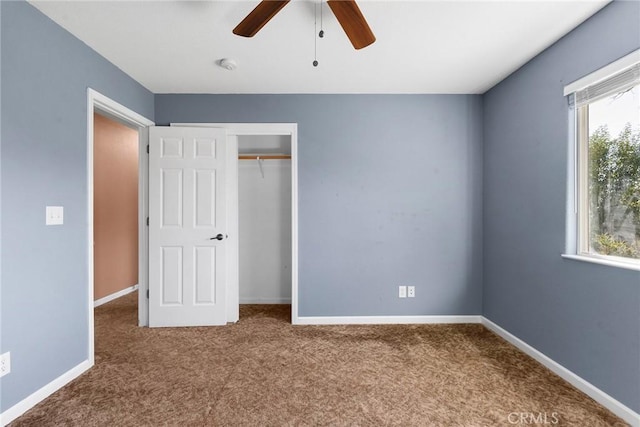 unfurnished bedroom featuring carpet flooring, ceiling fan, and a closet