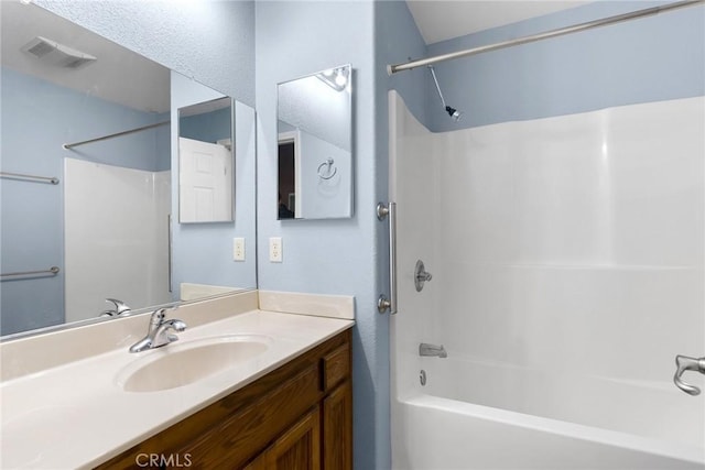 bathroom with vanity and shower / bath combination